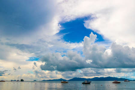 Bo Phut Beach with boats on Koh Samui island with view on Koh Pha-ngan, in Thailand.の写真素材