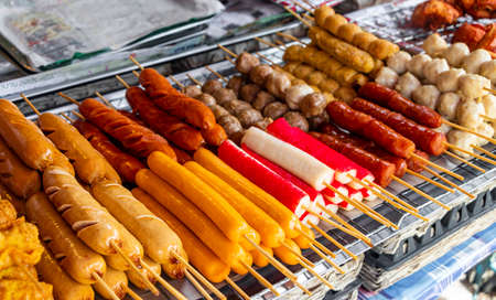 Thai food skewers of sausage chicken meatballs fishballs on the grill Bangrak Market Ko Samui Thailand.の写真素材