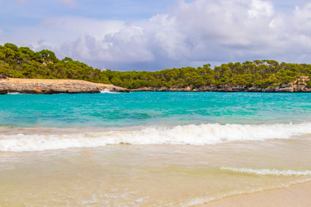 Turquoise beach and bay of Cala Samarador Amarador in Mallorca Balearic Islands Spain.の写真素材
