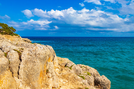 Turquoise cliffs and bay panorama of Cala Mondrago in Mallorca Balearic Islands Spain.の写真素材