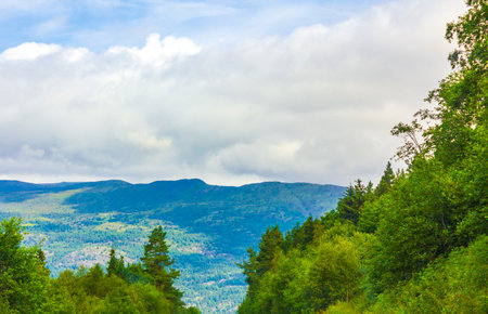 Amazing incredible norwegian landscape with mountains and forests in Jotunheimen National Park Norway.の写真素材