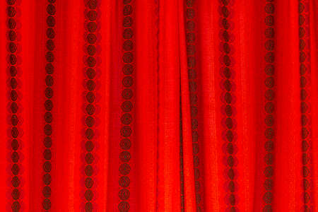 Red fabric cotton curtain or drape. Texture black stripes.の写真素材