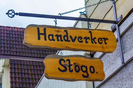 Wooden welcome sign Handverker Stogo at the entrance in small town Fagernes Norway.のeditorial素材