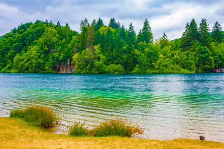 Plitvice Lakes National Park colorful turquoise blue and green water with waterfalls in Croatia.の写真素材