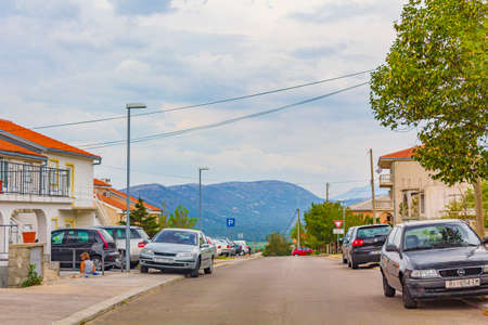 Novi Vinodolski cityscape road town buildings and mountains view in beautiful croatia.のeditorial素材