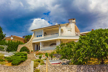 Typical white residential apartment hotel building in Novi Vinodolski Croatia.のeditorial素材