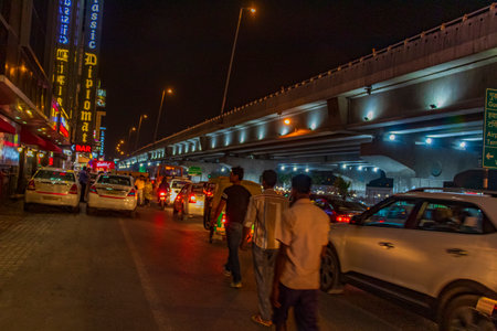 Nightlife and big traffic with Tuk Tuks buses and people in New-Delhi Delhi India.のeditorial素材