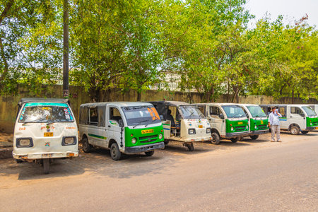 Life and big traffic with Tuk Tuks buses and people in New-Delhi Delhi India.のeditorial素材
