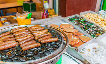 Seafood blue live crabs clams oysters and lobsters Thai market street food in China Town Bangkok Thailand.の写真素材