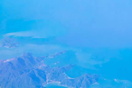 Flying over Thailand panoramic view of the beautiful islands coastal beaches turquoise waters and clouds.の写真素材