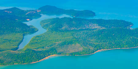 Flying over Thailand panoramic view of the beautiful islands coastal beaches turquoise waters and clouds.の写真素材
