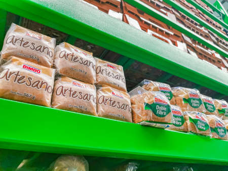 Playa del Carmen Mexico April 23, 2021 Bimbo white toast bread artesano and Doble Fibra packaging in the supermarket in Playa del Carmen Mexico.のeditorial素材