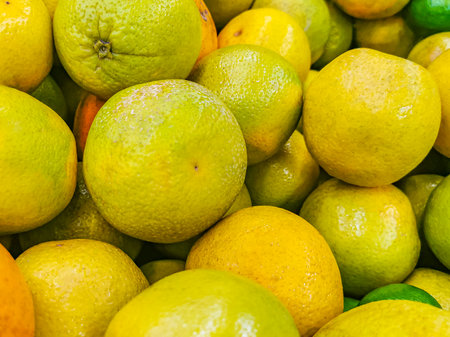 Juicy oranges tangerines yellow orange background texture from Playa del Carmen Mexico.の写真素材