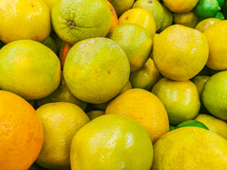 Juicy oranges tangerines yellow orange background texture from Playa del Carmen Mexico.の写真素材