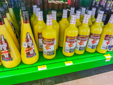 Playa del Carmen Mexico April 23, 2021 Buy yellow Rompope Coronado Santa Clara Amond or Vanilla liquor eggnog-like drink made with eggs in Mexico.のeditorial素材