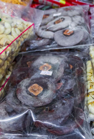 Selection of fruits nuts and seeds packages Thai food and Chinese cuisine in street food old market...