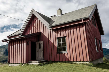 Beautiful red wooden cabin hut in Vang i Valdres, Innlandet, Norway.の写真素材