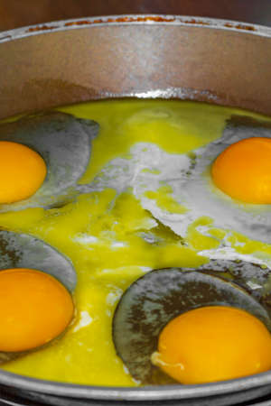 Fry eggs and make fried eggs in the pan in the morning.の写真素材
