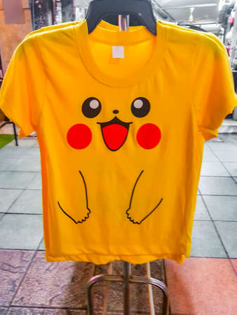 Yellow funny Pikachu face Pokemon T-shirt for sale in Bangkok Thailand.のeditorial素材