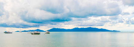 Bo Phut Beach panorama with boats on Koh Samui island with view on Koh Pha-ngan in Thailand.の写真素材
