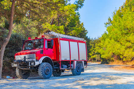Red old fire truck on Filerimos hill in Ialysos forest on Rhodes in Greece.
