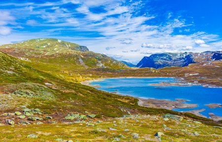 Amazing Vavatn lake panorama rough landscape view rocks boulders and mountains during summer in Hemsedal Norway.の写真素材