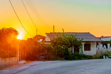 Golden colors of the most beautiful sunset at Ialysos Beach on Rhodes Island Greece.の写真素材