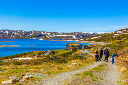 Hikers and tourists at the rough landscape of Vavatn lake and mountains during summer in Hemsedal Norway.のeditorial素材