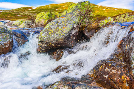 Beautiful Storebottane river by the vavatn lake with snow in the summer landscape in Hemsedal...