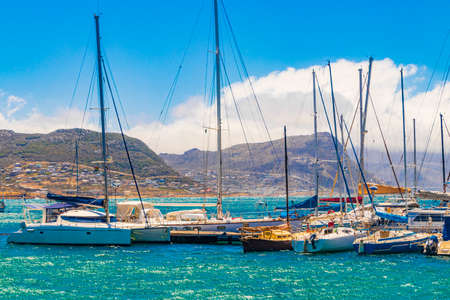 False Bay coast landscape with yachts boats jetty Long Beach and mountains in Simons Town Cape Town Western Cape South Africa.の写真素材