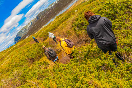 Viken Norway June 9th, 2016 Hikers and tourists at the rough landscape of Vavatn lake and mountains during summer in Hemsedal Norway.のeditorial素材
