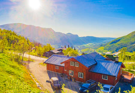Beautiful landscape panorama of Norway Hemsedal Skicenter with Mountains cabins huts and blue sky.のeditorial素材