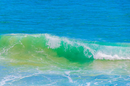 Strong waves at amazing Praia de Lopes Mendes beach on the big tropical island Ilha Grande in Angra dos Reis Rio de Janeiro Brazil.の写真素材
