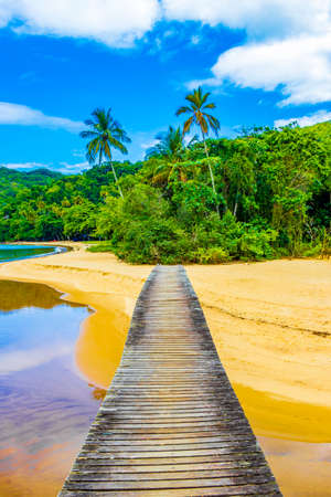 Amazing Mangrove beach and Pouso beach on with wooden bridge the big tropical island Ilha Grande Rio de Janeiro Brazil.の写真素材