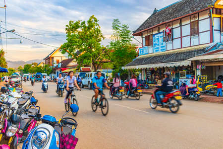 Luang Prabang Laos November 17, 2018 Sunset at typical colorful street road and cityscape with traffic jam and rush hour Luang Prabang Laos.のeditorial素材