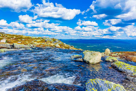 Amazing panorama view from top of the Hydnefossen waterfall and VeslehÃ¸dn Veslehorn mountain in Hemsedal Norway.の写真素材