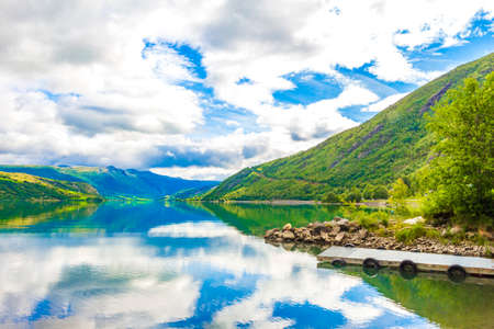 Amazing incredible norwegian landscape with colorful mountains fjord and forests in Jotunheimen National Park Norway.の写真素材