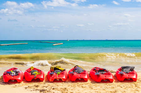 Red canoes at tropical mexican beach panorama view from Playa 88 and Punta Esmeralda in Playa del Carmen Mexico.の写真素材