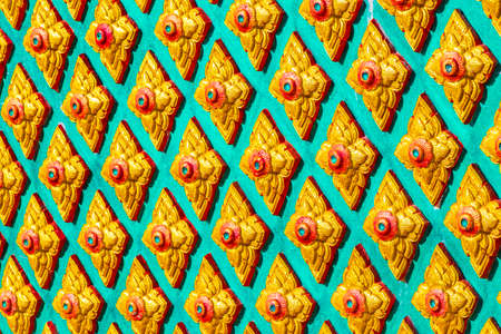 Beautiful colorful golden architecture details in Wat Phadung Tham Phothi temple in Khao Lak Phang-nga Thailand.の写真素材