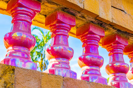 Beautiful colorful golden architecture details Pink columns in Wat Phadung Tham Phothi temple in Khao Lak Phang-nga Thailand.の写真素材