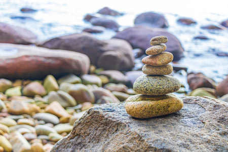 Stapled stacked stones in the beautiful amazing coast line and beach landscape panorama view of the Lam ru Lamru National Park in Khao Lak Phang-nga Thailand.の写真素材