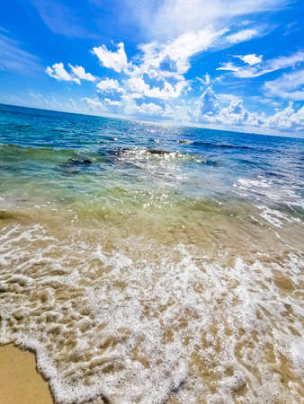 Tropical mexican beach panorama view with turquoise blue clear water cenote and boulder stones and rocks from Playa 88 and Punta Esmeralda in Playa del Carmen Mexico.の写真素材