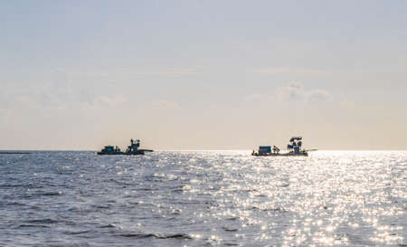 Fishing boats at tropical mexican beach panorama view with turquoise blue water from Playa 88 and Punta Esmeralda in Playa del Carmen Mexico.の写真素材