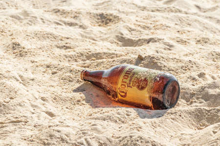 Playa del Carmen August 05, 2021 Corona beer bottles garbage pollution on tropical mexican beach 88 Punta Esmeralda in Playa del Carmen Mexico.のeditorial素材