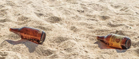 Playa del Carmen August 05, 2021 Corona beer bottles garbage pollution on tropical mexican beach 88 Punta Esmeralda in Playa del Carmen Mexico.のeditorial素材