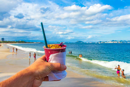 Brazilian superfood berry aÃ§aÃ­ in a mug as ice at Guanabara Bay Flamengo Beach Rio de Janeiro Brazil.の写真素材
