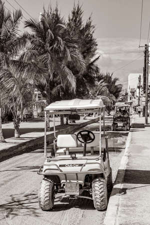 Holbox Mexico December 21, 2021 Black and white picture of a golf cart buggy cars carts on muddy street in the village on Holbox island Mexico.のeditorial素材