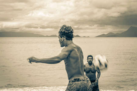 Ilha Grande Brazil November 23, 2020 Black and white picture of male soccer players at the big tropical island Ilha Grande Praia de Palmas beach in Angra dos Reis Rio de Janeiro Brazil.のeditorial素材