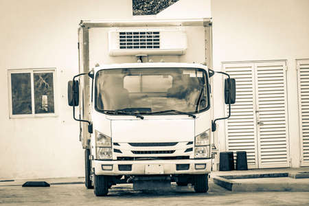 Black and white picture of a mexican truck car with refrigerated trailer at Gulf petrol gas station in Puerto Aventuras in Quintana Roo Mexico.の写真素材