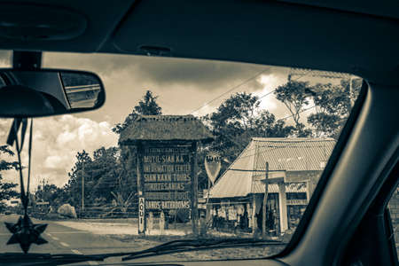 Tulum Mexico February 02, 2022 Old black and white picture of a parking lot with cars and gravel path road to the entrance to Muyil Chunyaxche Quintana Roo Mexico.のeditorial素材